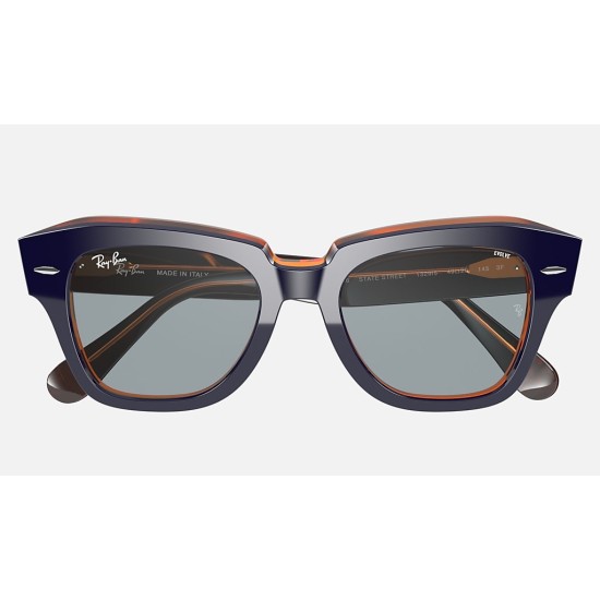 STATE STREET ORANGE FLUO
Lenses: Blue Photochromic Classic  +  Frame: Blue on Orange Fluo